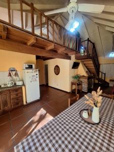 a kitchen with a table with a table cloth at La Rocca in Colón