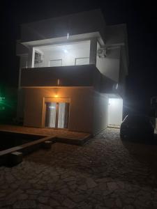 a house in the night with a light on at Lux Villa Azur in Bar