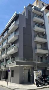 a building with a motorcycle parked in front of it at Lavandula in Xanthi