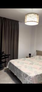 a white room with a bed and a window at Dina in Golem
