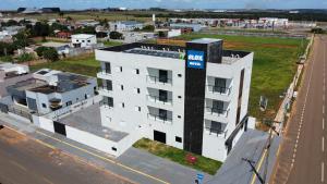 an aerial view of a white building at Hotel Blox Sorriso in Sorriso