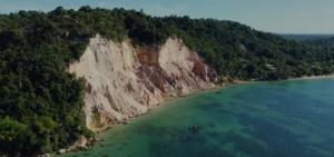 an aerial view of a beach with trees and water at Pousada pôr do sol in Cairu +9 photos
