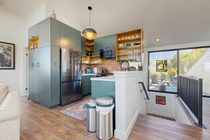 a kitchen with a stainless steel refrigerator freezer at Heron Escape in Bodega Bay