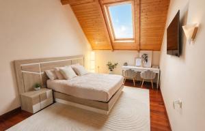 a bedroom with a bed and a window and a table at VILLA PANGEA - Guest House - Camino del Norte in Castro-Urdiales