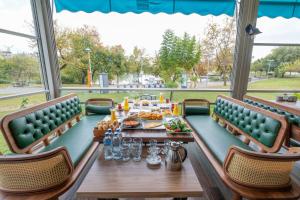 a dining room with a table and chairs at River suite hotel in Manavgat