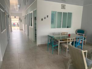 a dining room with a table and chairs at Acacias home in Acacías