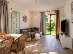 a living room with a couch and a table at Ferienwohnung Feichten in Westendorf