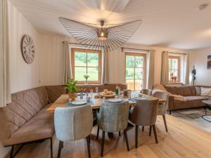 a living room with a table and a couch at Haus Ganbei in Donnersbachwald