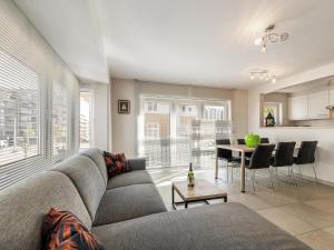 a living room with a couch and a table at Elisa Beta in Nieuwpoort-Bad