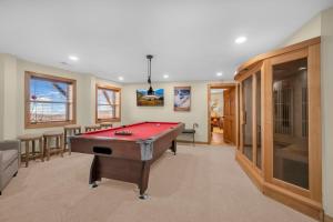 a room with a pool table in a house at Soaring Eagles View in Beech Mountain