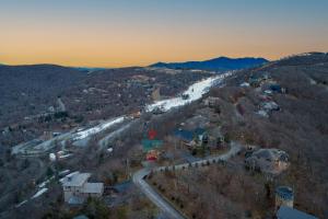 an aerial view of a road in a town with snow at Soaring Eagles View in Beech Mountain
