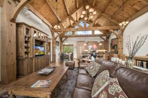a living room with a couch and a table at Wolf Ridge Lodge in Boone