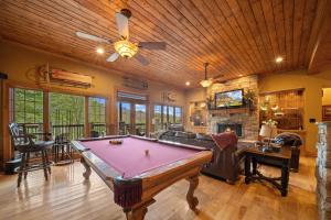 a living room with a pool table in it at Birds Nest On Sugar Mountain in Sugar Mountain