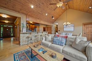 a living room with a couch and a bar at Birds Nest On Sugar Mountain in Sugar Mountain +42 photos