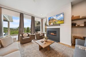 a living room with a couch and a fireplace at Luxury Trails Escape in Boone +55 photos