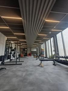 a gym with treadmills and machines in a building at Studio Bliss in Neuquén