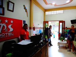 a group of people standing in a room at Hotel Pampa & Selva in Rurrenabaque