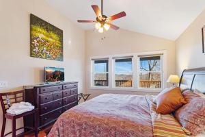 a bedroom with a bed and a ceiling fan at Appalachian Ski Mountain Chalet in Blowing Rock