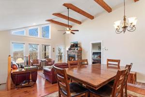 a dining room and living room with a table and chairs at Appalachian Ski Mountain Chalet in Blowing Rock +14 photos