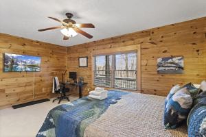 a bedroom with a bed and a ceiling fan at A-Typical in Boone