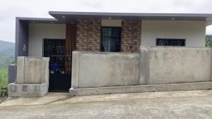 a house with concrete barriers in front of it at Engil's Studio in San Jose Dinagat Islands Philippines in Bulawan