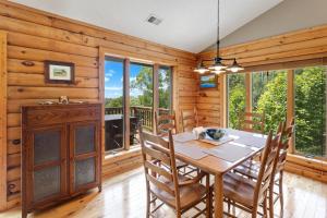 a dining room with a table and chairs at Blue Mist in Blowing Rock