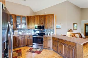 a kitchen with wooden cabinets and a stove top oven at Blue Mist in Blowing Rock