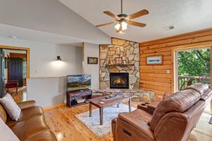 a living room with a couch and a fireplace at Blue Mist in Blowing Rock