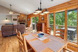 a dining room and living room with a table and chairs at Blue Mist in Blowing Rock +24 photos