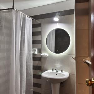 a bathroom with a sink and a mirror at Hotel Inkalma Santa Marta in Arequipa +76 photos