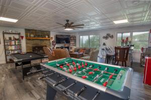 a living room with a pool table at Eagles Nest on Seven Devils in Seven Devils
