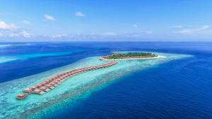 an island in the ocean with a resort at Hurawalhi Island Resort in Kuredu