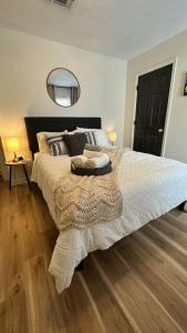 a bedroom with a large bed and a mirror at Spacious Golf Retreat with Sunset Views in Columbus +29 photos