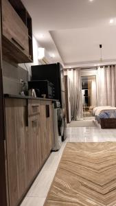a living room with a kitchen and a bedroom at Avenue Alhambra princess resort in Hurghada