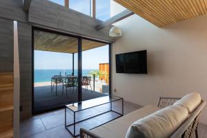 a living room with a couch and a view of the ocean at KONA OCEAN Club in Awaji