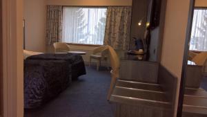 Ένα ή περισσότερα κρεβάτια σε δωμάτιο στο Hotel Falster