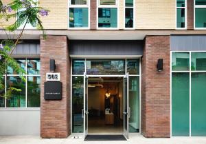 an entrance to a building with a glass door at The Margot Hotel San Diego Gaslamp Quarter, Outset by Hilton in San Diego
