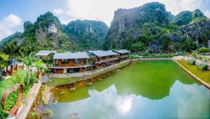 an aerial view of a resort with a lake at Hang Mua Eco Park in Ninh Binh +240 photos