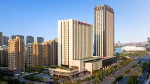 an aerial view of a city with tall buildings at Crowne Plaza Hangzhou Qiantang in Hangzhou