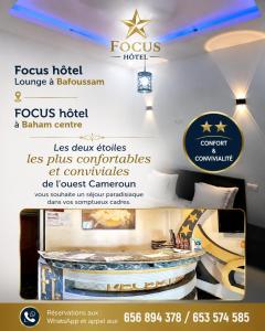 a poster for a hotel with a sign for a room at FOCUS hotel in Baham