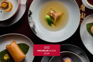 a table with plates of food and a sign that says michigan curry at The Langham, Shanghai, Xintiandi in Shanghai
