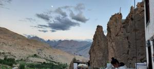 a group of people looking at the mountains at Mochilero Eyrie in Kaza