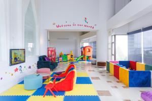 a childrens play room with colorful furniture and a sign that reads welcome to our at D Varee Jomtien Beach, Pattaya in Jomtien Beach
