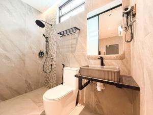 a bathroom with a toilet and a sink at Havona Boutique Hotel - Mount Austin - Self Check-in in Johor Bahru +15 photos