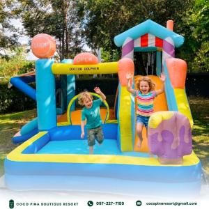 two children playing on an inflatable play structure at Coco Pina in Prachuap Khiri Khan