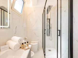 a bathroom with a shower and a sink at Bari Home in Bari