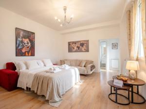 a living room with a bed and a couch at Bari Home in Bari