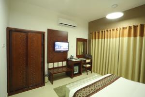 Postel nebo postele na pokoji v ubytování Zaki Hotel Apartment