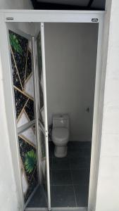 an open door to a bathroom with a toilet at wawa homestay in Butterworth