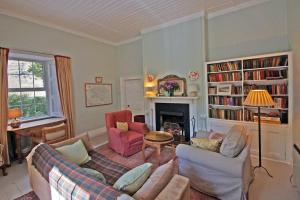 a living room with a couch and chairs and a fireplace at 4 Bed in Renvyle oc-i258 in Salrock
